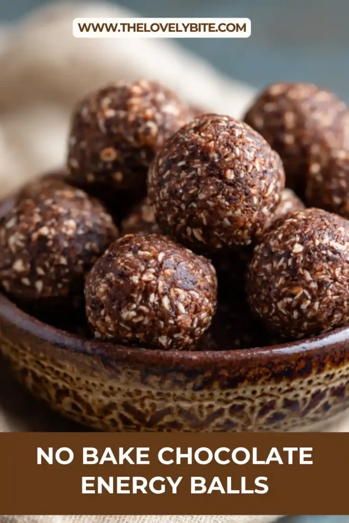 Close-up view of chocolate energy balls with a soft fudgy center and cocoa-rich flavor. These no-bake snacks are made with wholesome pantry ingredients.