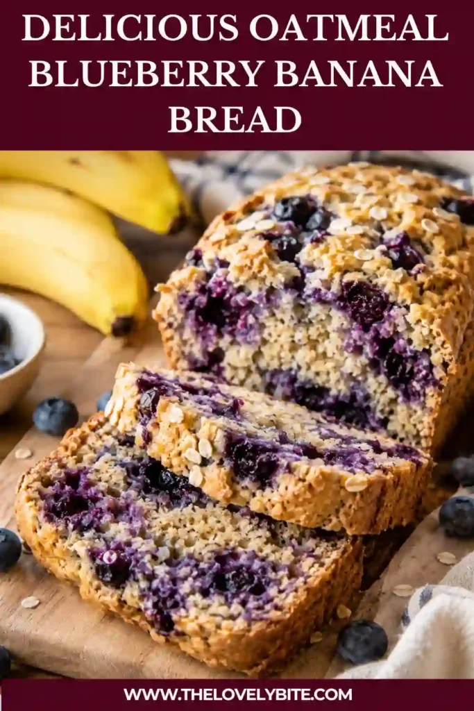 A freshly baked Oatmeal Blueberry Banana Bread cooling on a wire rack with golden edges and fresh blueberries on top. This healthy banana bread is naturally sweetened and perfect for breakfast.