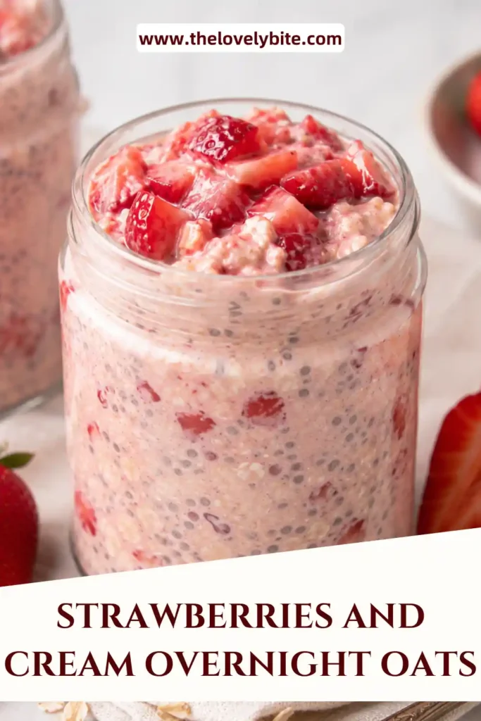 Strawberries and Cream Overnight Oats prepared in a glass container with chia seeds and strawberry pieces throughout. A nutritious breakfast ready to enjoy straight from the fridge.