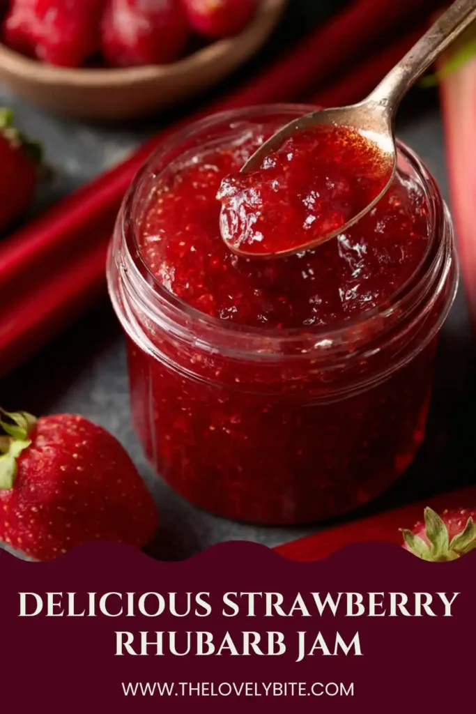 A jar of homemade Strawberry Rhubarb Jam with a vibrant red color and visible fruit texture. This sweet and tangy fruit preserve is perfect for canning and spreading on fresh bread.