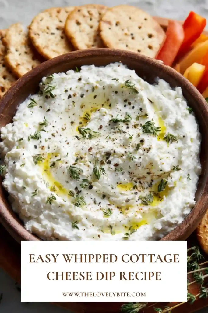 Smooth whipped cottage cheese dip garnished with fresh herbs and olive oil. A healthy homemade appetizer made with lemon and cottage cheese.