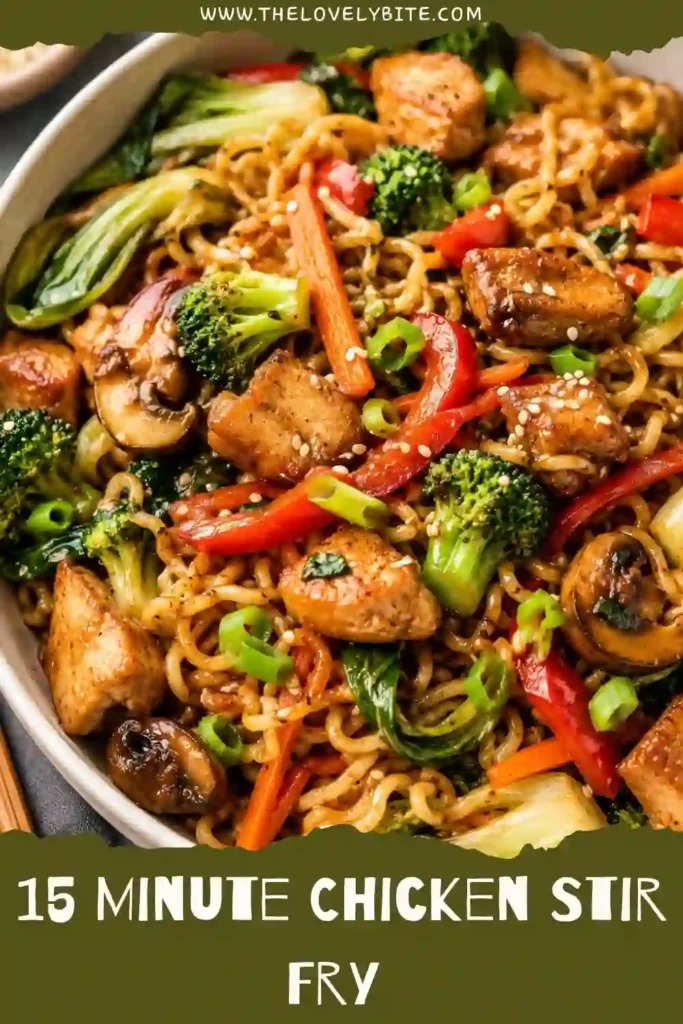 Fresh chicken stir fry served in a bowl with sesame seeds, green onions, colorful vegetables, and yakisoba noodles. A healthy chicken stir fry made in one pan.