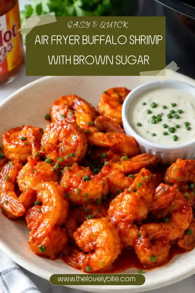 1. Crispy Air Fryer Buffalo Shrimp coated in sweet and spicy brown sugar buffalo sauce, garnished with fresh chives and served with ranch dressing in natural lighting.