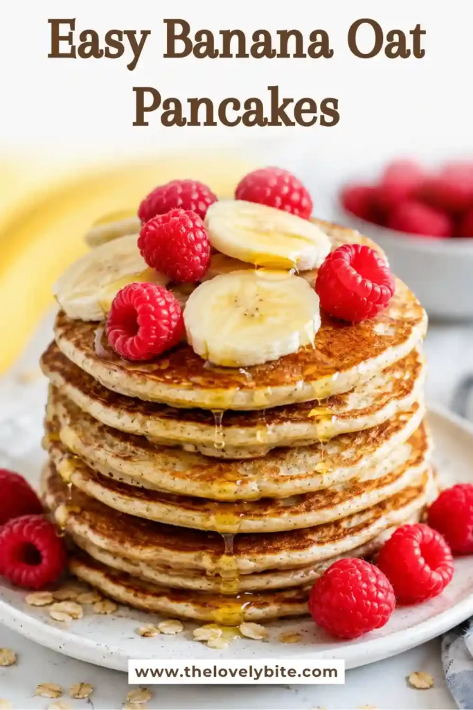 Golden Banana Oat Pancakes served with sliced bananas, blueberries, and a drizzle of maple syrup. A simple blender pancake recipe perfect for healthy mornings.