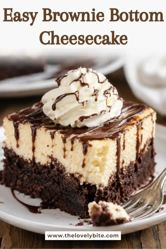 Homemade Brownie Bottom Cheesecake featuring creamy baked cheesecake layered over fudgy brownies and finished with whipped cream and warm chocolate fudge.