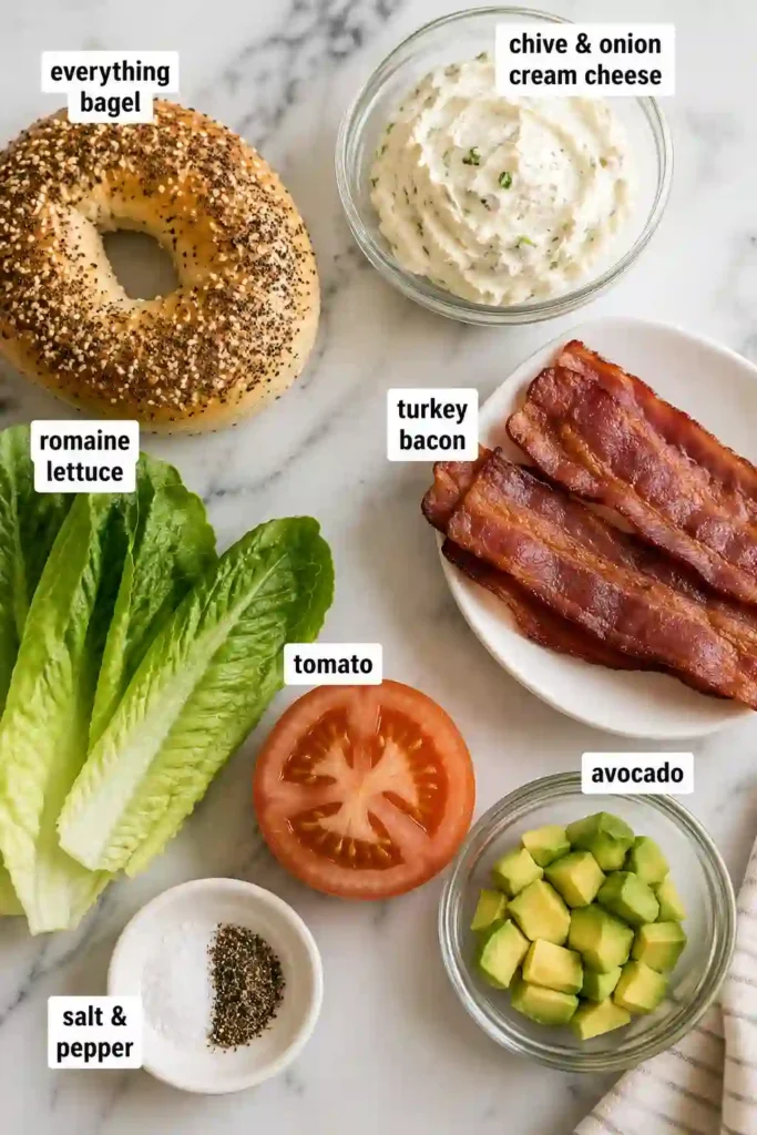 A toasted California BLT Chopped Bagel filled with chopped turkey bacon, creamy chive and onion cream cheese, fresh avocado, lettuce, and tomato. The sandwich is colorful, fresh, and perfect for breakfast or lunch.