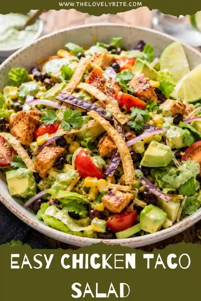 Healthy Chicken Taco Salad topped with taco-seasoned chicken, fresh vegetables, avocado, and homemade cilantro vinaigrette.