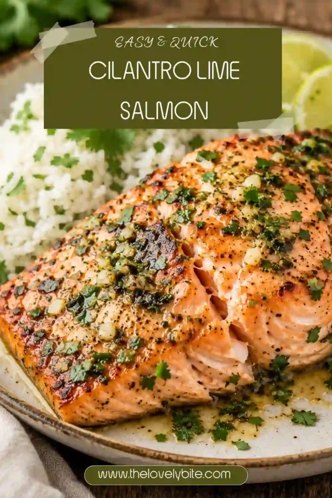 Freshly baked Cilantro Lime Salmon topped with garlic cilantro sauce, tomato slices, and lime rounds. The salmon is tender, flaky, and beautifully golden.