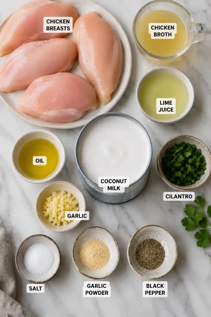 Creamy Coconut Lime Chicken served in a skillet with fresh cilantro and a rich coconut milk sauce. Tender chicken breasts are coated in a silky lime-infused sauce perfect for a comforting dinner.