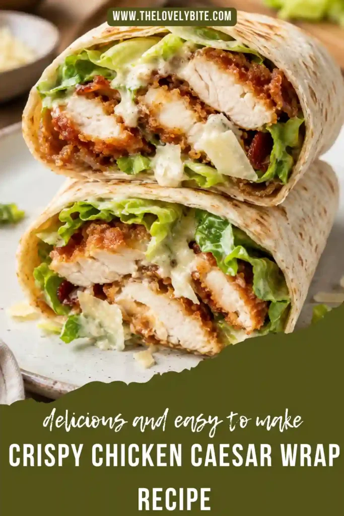 A Crispy Chicken Caesar Wrap filled with breaded chicken, romaine lettuce, turkey bacon, Parmesan cheese, and homemade Caesar dressing, sliced in half on a serving board.