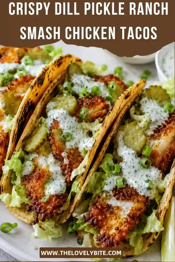 Homemade Crispy Dill Pickle Ranch Smash Chicken Tacos arranged on a serving platter with creamy ranch, pickles, and fresh toppings. Perfect for taco night or casual family dinners.
