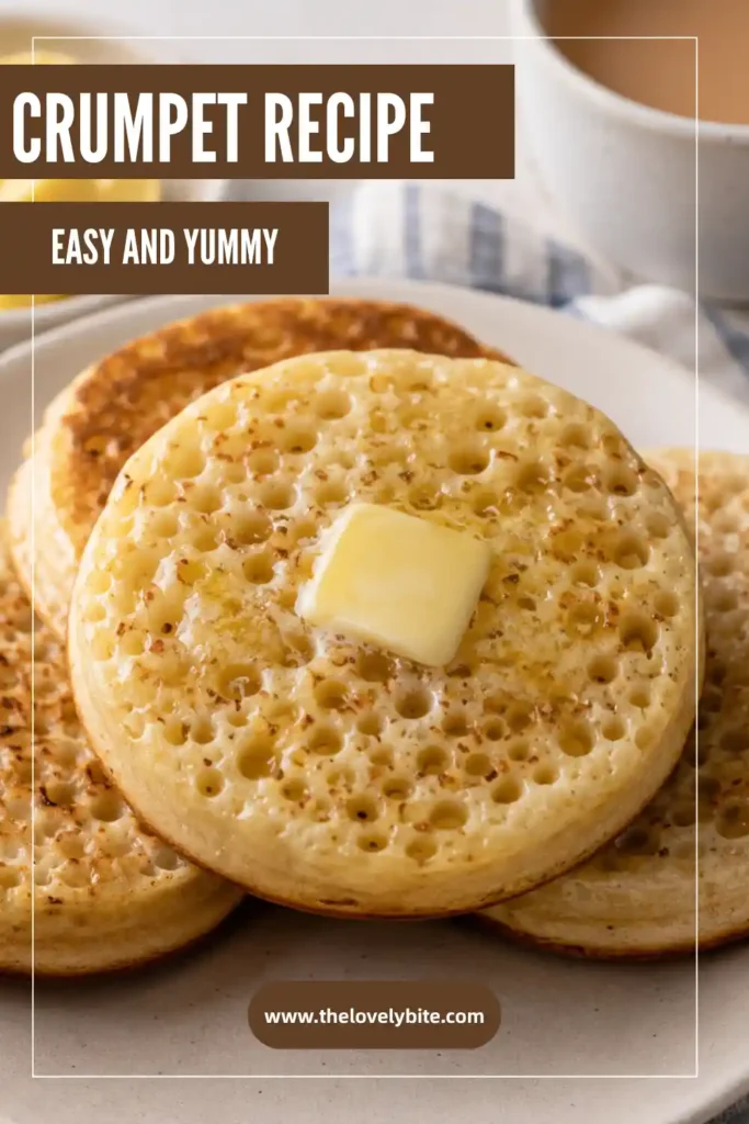Homemade British crumpets with classic honeycomb holes served on a wooden board with butter and honey. Soft, fluffy, and golden brown.