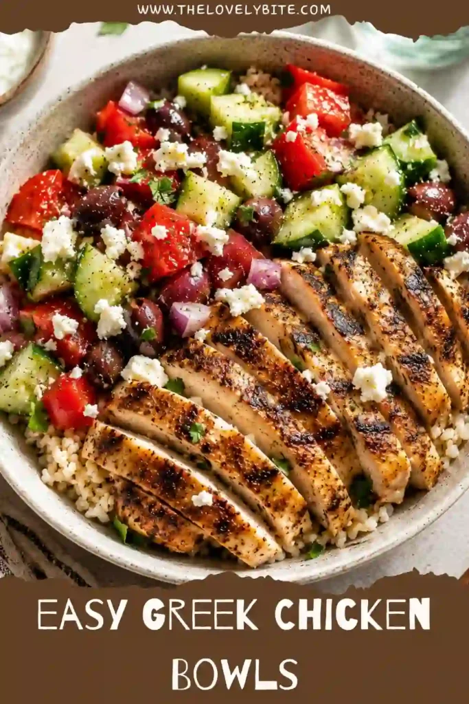 A homemade Greek Chicken Bowl featuring juicy marinated chicken, seasoned rice, Greek cucumber salad, Kalamata olives, and creamy feta cheese. Every ingredient creates a vibrant Mediterranean-inspired meal.