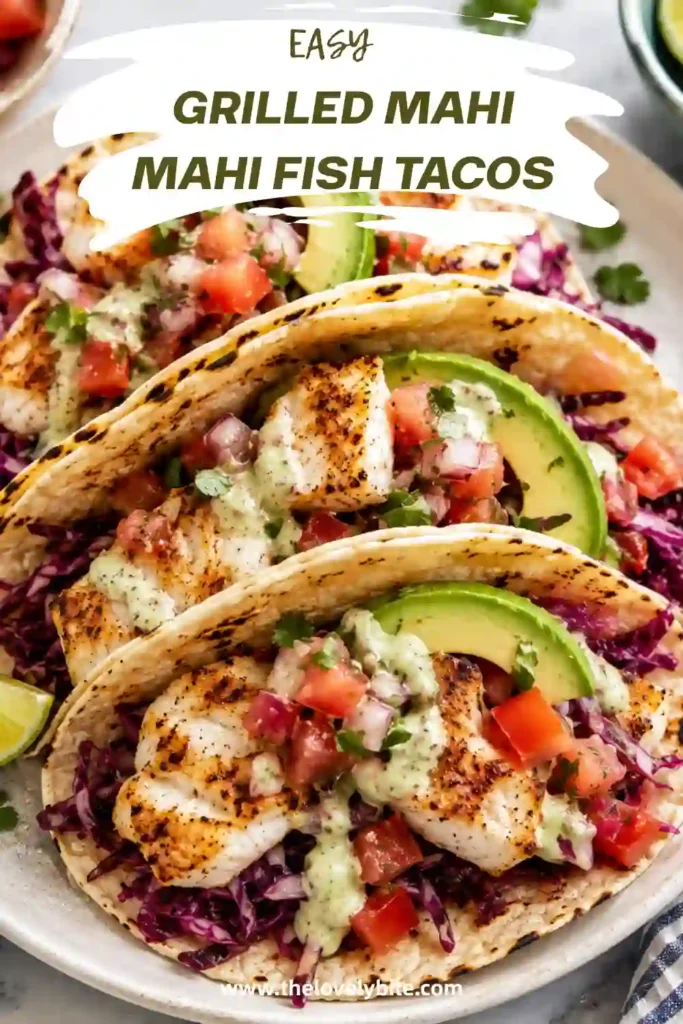 Homemade Grilled Mahi Mahi Fish Tacos topped with cabbage slaw, avocado slices, and pico de gallo on warm corn tortillas. A healthy seafood recipe ready in under 30 minutes.