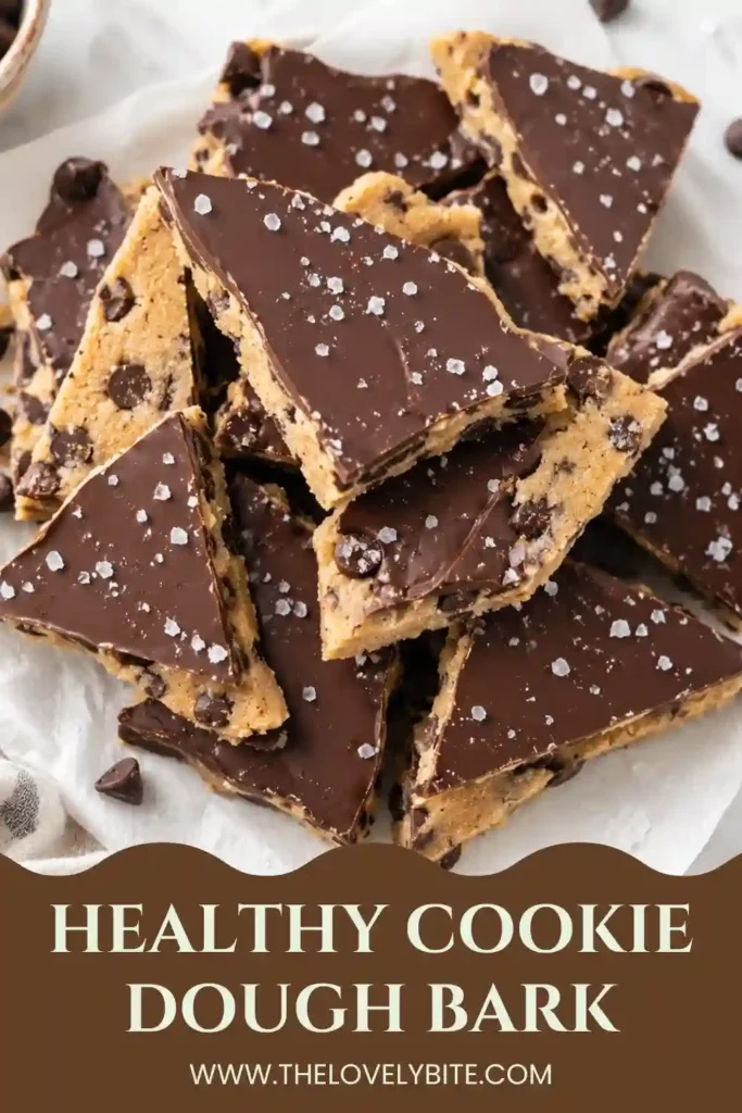 A stack of Healthy Cookie Dough Bark featuring creamy gluten-free cookie dough beneath a thick chocolate layer. This easy freezer dessert has a rich texture and homemade appearance.