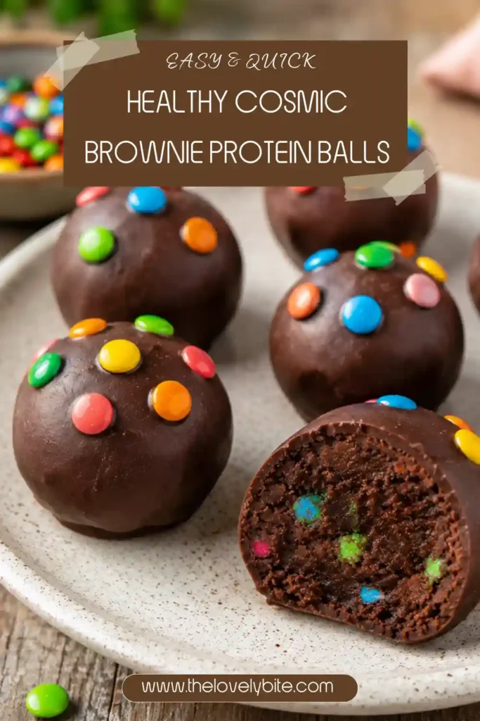 Chocolate-covered Healthy Cosmic Brownie Protein Balls served on parchment paper with colorful sprinkles. A delicious gluten free high protein dessert that's easy to make and naturally vegan.