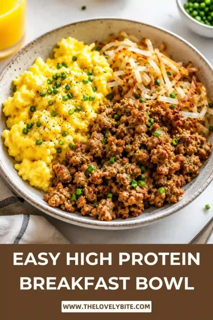 A High Protein Breakfast Bowl filled with seasoned ground turkey, fluffy cottage cheese scrambled eggs, crispy shredded potatoes, fresh avocado slices, and chopped herbs. This healthy breakfast bowl is colorful, hearty, and packed with protein for a satisfying morning meal.
