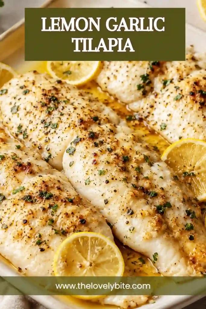 A baked Lemon Garlic Tilapia fillet topped with fresh parsley and lemon slices on a white serving platter. The flaky fish is lightly seasoned and golden around the edges.