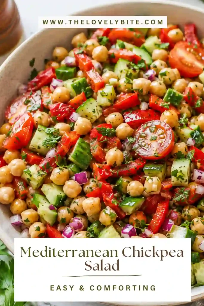 Healthy Mediterranean Chickpea Salad made with fresh cucumber, tomatoes, roasted peppers, parsley, mint, avocado, and a tangy lemon dressing. A colorful vegetarian dish packed with flavor.