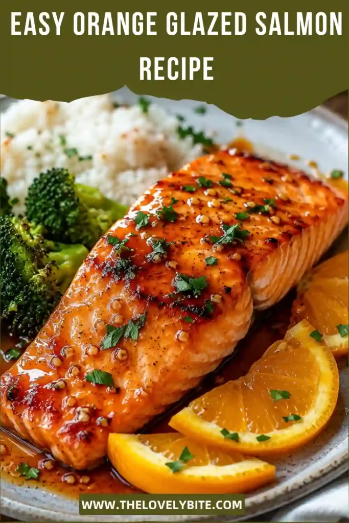 A close-up of Orange Glazed Salmon coated in a rich honey orange glaze with garlic. This easy orange salmon recipe is served fresh from the skillet for a delicious family meal.