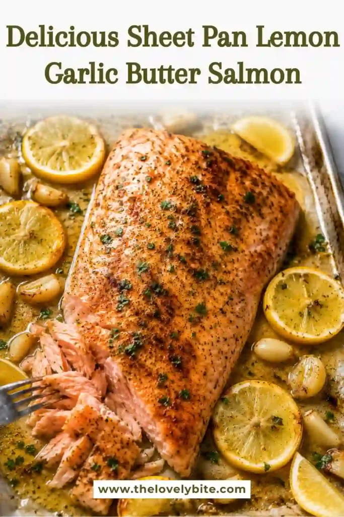 A flavorful baked salmon recipe served with garlic butter, lemon slices, and herbs on a sheet pan. This healthy salmon recipe is ideal for quick family dinners.