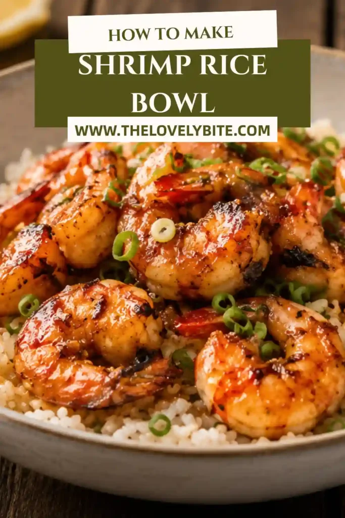 Asian-inspired Shrimp Rice Bowl topped with garlic butter shrimp, chopped green onions, and fresh lemon slices served in a ceramic bowl.