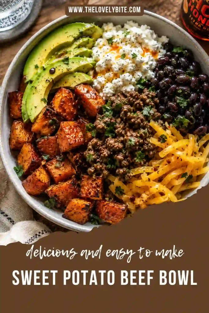 A colorful Sweet Potato Beef Bowl filled with roasted sweet potatoes, seasoned ground beef, black beans, cottage cheese, avocado, cheddar cheese, and hot honey. This high-protein meal is vibrant, hearty, and perfect for meal prep.
