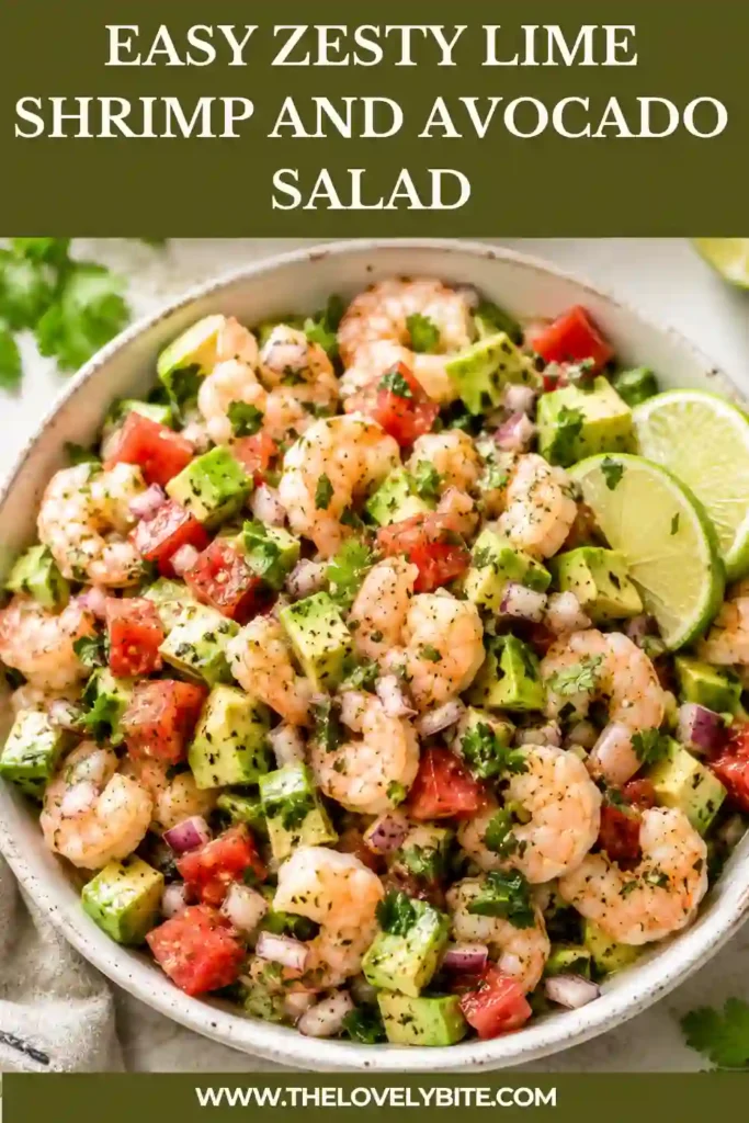Fresh Zesty Lime Shrimp and Avocado Salad served in a white bowl with juicy shrimp, creamy avocado, tomatoes, cilantro, and lime wedges. A colorful healthy shrimp salad perfect for lunch.