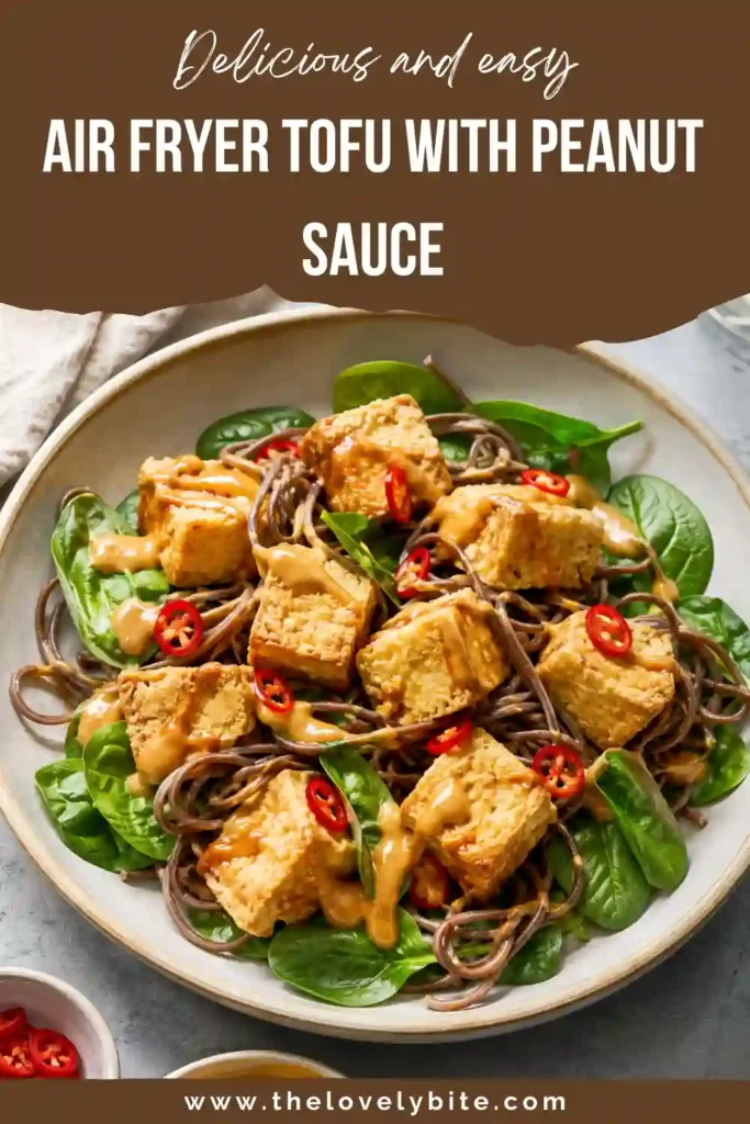 Golden crispy air fryer tofu sits on warm soba noodles with spinach and rich peanut sauce. This colorful healthy tofu recipe makes an easy weeknight meal.