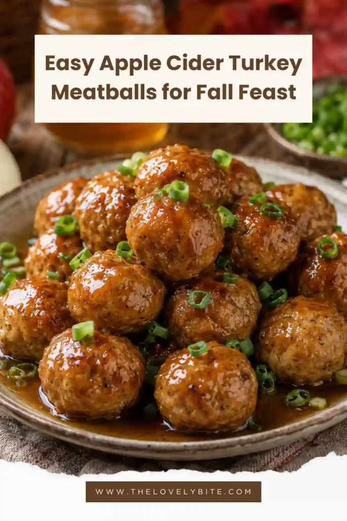 Baked Apple Cider Turkey Meatballs in a sweet and savory maple cider glaze. Fresh green onions garnish the golden turkey meatballs for a colorful autumn presentation.