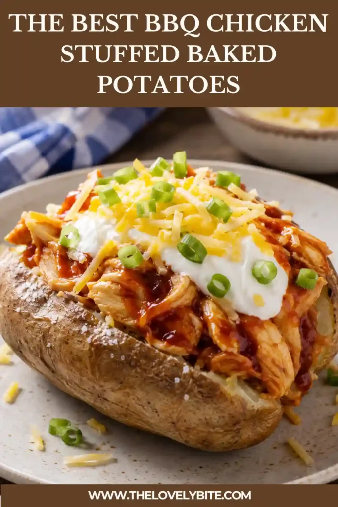 Loaded baked potatoes filled with barbecue chicken, shredded cheese, sour cream, and chopped chives are served warm for an easy chicken dinner. The fluffy potato pairs perfectly with the rich barbecue filling.
