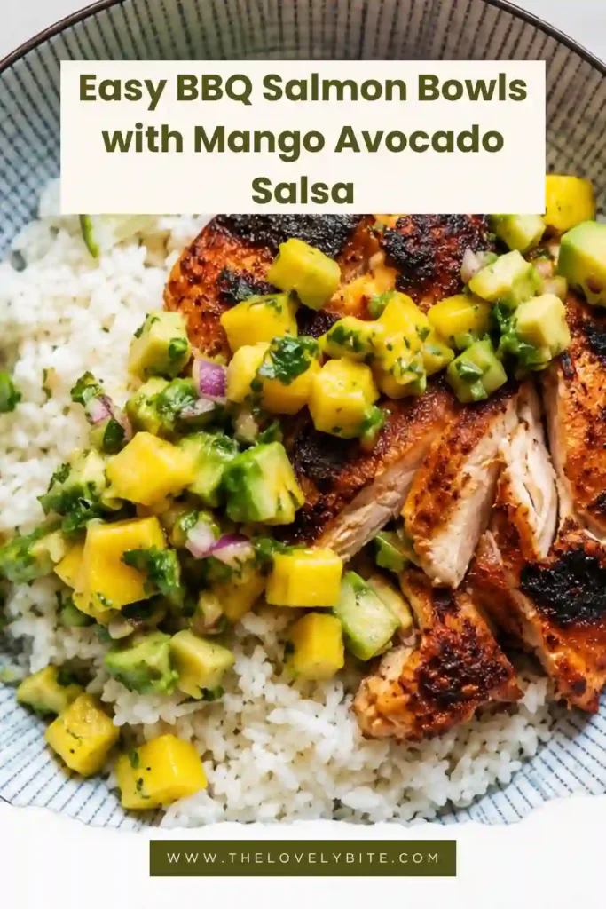 Healthy salmon bowls featuring BBQ-seasoned salmon, rice, and homemade mango avocado salsa. Juicy mango, creamy avocado, red onion, cilantro, and lime create a fresh colorful topping.