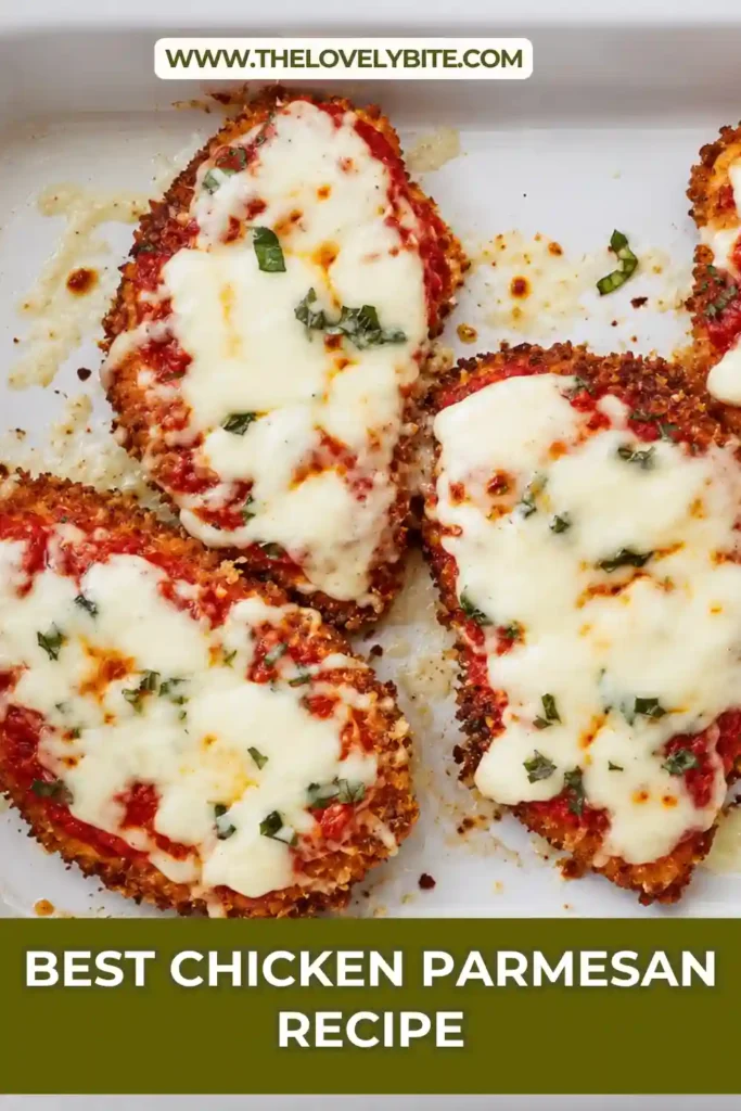 Homemade Chicken Parmesan with a crisp golden crust, tomato sauce, mozzarella, provolone, and freshly grated Parmesan. The finished chicken is topped with vibrant fresh basil.