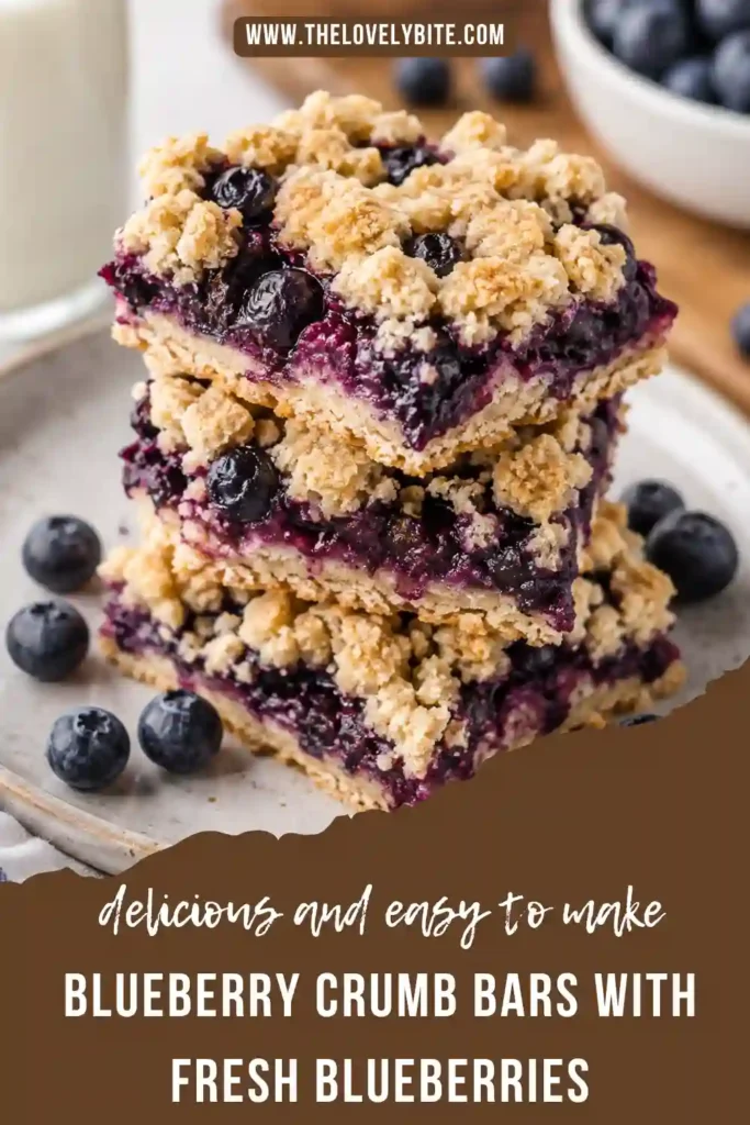 Blueberry Crumb Bars with a juicy fresh blueberry center and buttery golden crumble topping. The dessert bars are sliced into squares with vibrant blueberry filling visible between the layers.