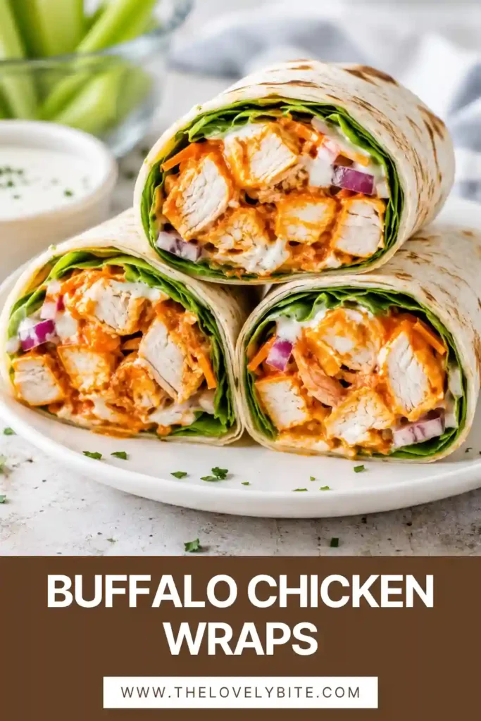 Buffalo Chicken Wraps with tender chicken strips coated in buffalo sauce and topped with ranch, lettuce, carrots, red onion, and cheddar cheese. These spicy chicken wraps are rolled in soft tortillas for an easy meal.