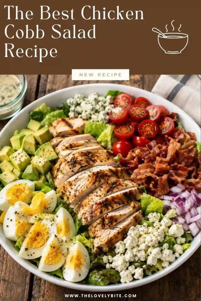 A homemade Chicken Cobb Salad topped with sliced grilled chicken, creamy avocado, cherry tomatoes, hard-boiled eggs, cucumber, and ranch dressing. A fresh and satisfying American salad recipe.