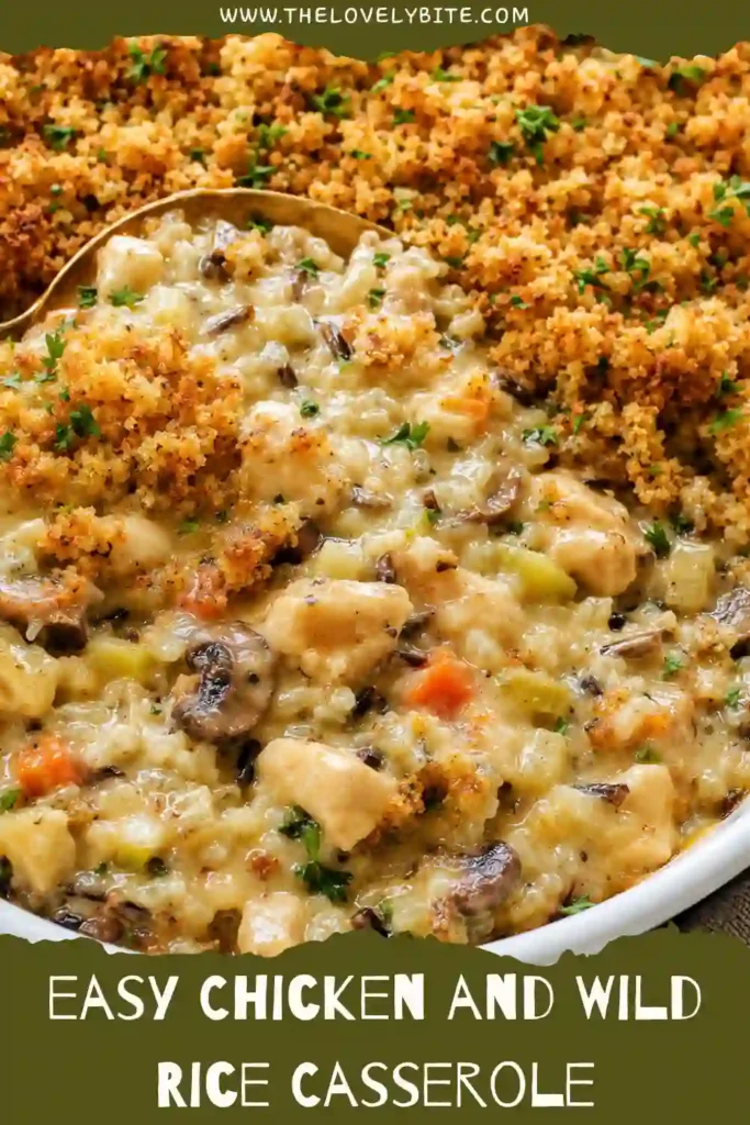 Cheesy wild rice casserole baked until bubbling and golden, filled with chicken, mushrooms, carrots, celery, garlic, and creamy cheese sauce. Toasted panko breadcrumbs cover the top for extra crunch.