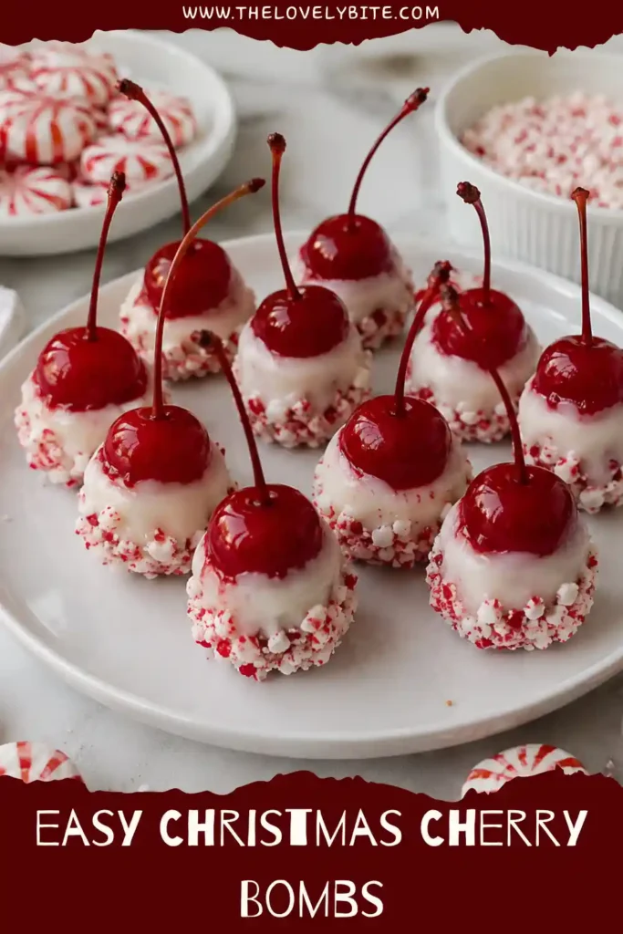 A close-up of Christmas Cherry Bombs featuring juicy maraschino cherries, creamy white chocolate, and crunchy peppermint pieces. These peppermint cherries have a festive red, white, and peppermint candy coating.