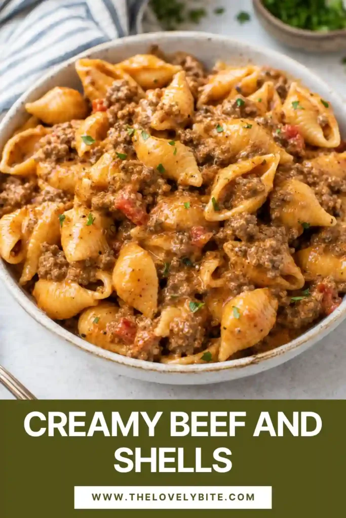 Creamy Beef and Shells with tender pasta shells and seasoned ground beef coated in a rich tomato cream and cheddar sauce. Fresh parsley adds color to the cheesy pasta skillet.