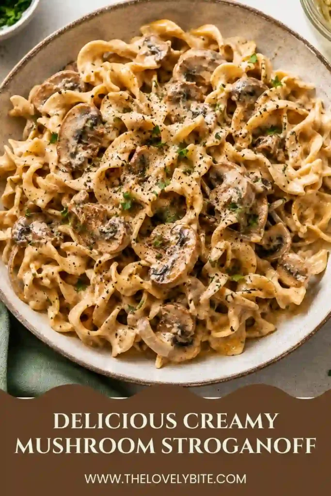 Close-up of creamy mushroom pasta featuring tender egg noodles coated in a savory mushroom stroganoff sauce. Garnished with fresh herbs for a beautiful presentation.