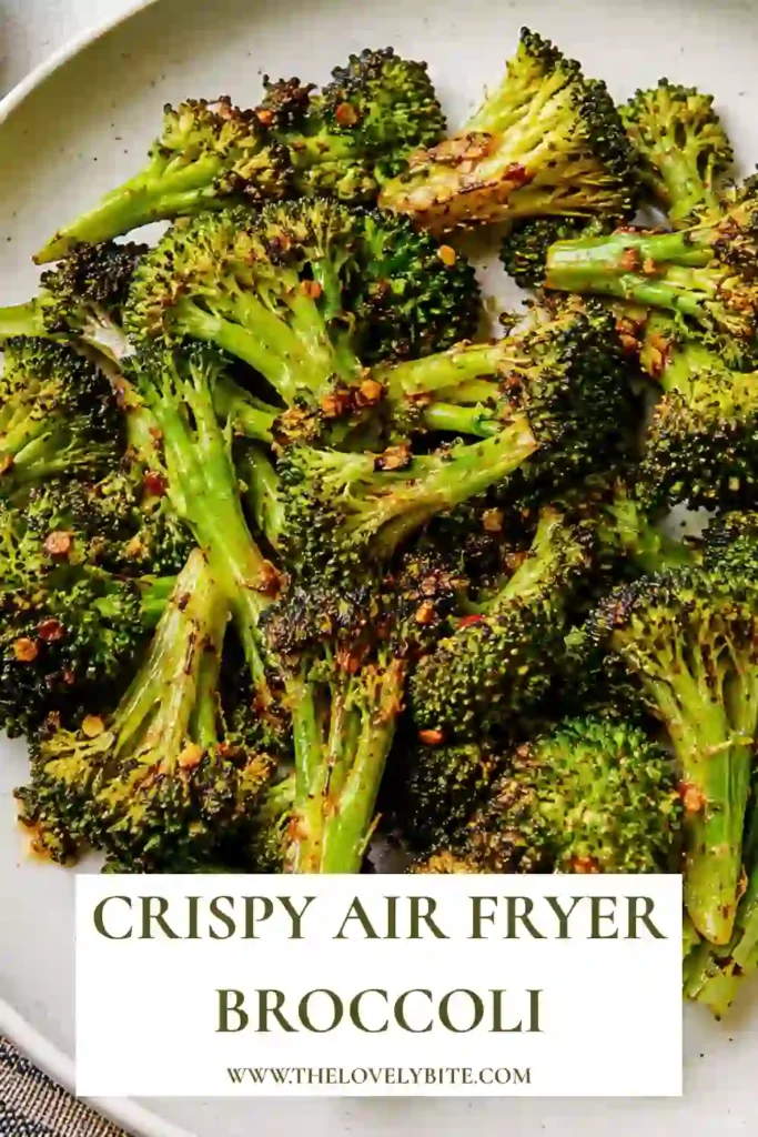 A serving of air fryer broccoli with golden-brown edges and tender florets. This crispy broccoli recipe makes a simple vegetable side for an easy family dinner.