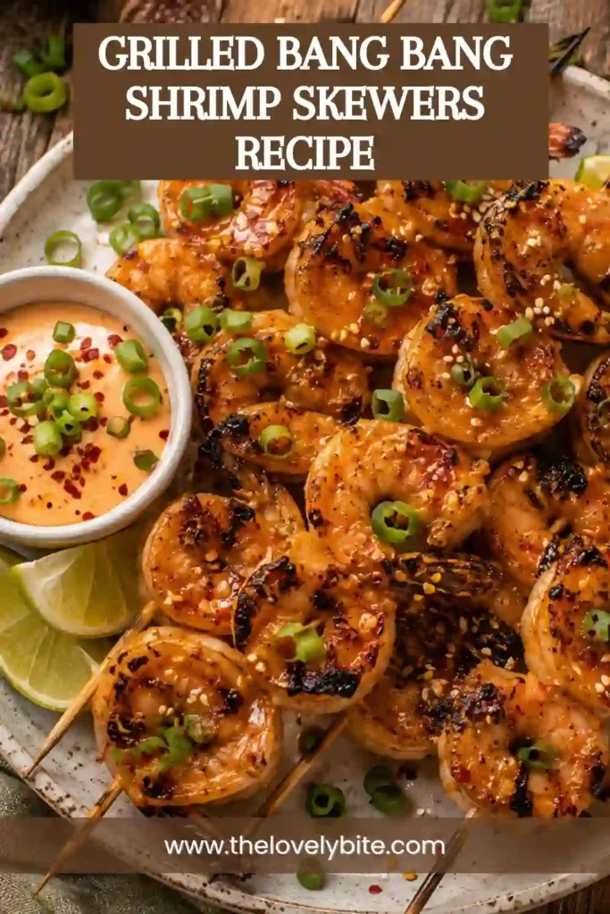 Golden grilled shrimp skewers glazed with homemade bang bang sauce and garnished with fresh scallions. This easy grilled seafood recipe is perfect for summer meals and outdoor entertaining.