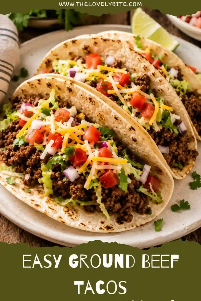Homemade beef tacos filled with flavorful ground beef and topped with lettuce, cheese, tomatoes, and red onions. These easy tacos are served warm for a quick weeknight dinner.
