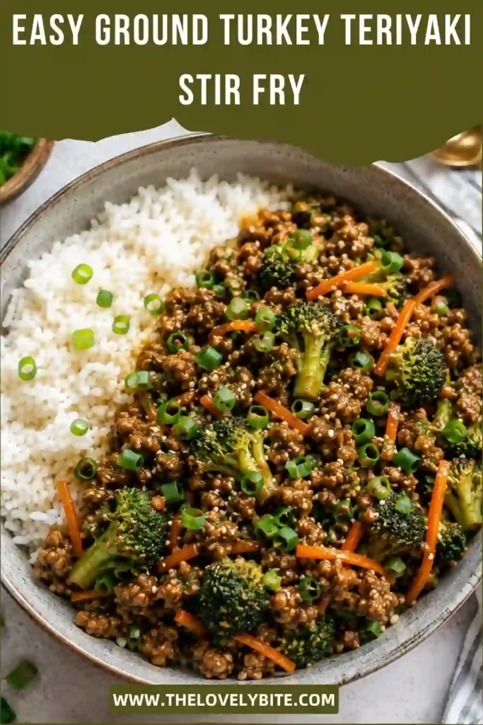 A close-up of ground turkey stir fry coated in homemade teriyaki sauce with broccoli and shredded carrots. The colorful meal is served over steamed rice for a comforting weeknight dinner.