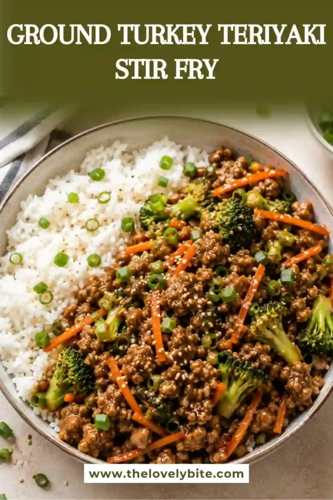 Homemade turkey teriyaki stir fry with ground turkey, broccoli, carrots, and onion served in a skillet. The healthy stir fry has a glossy sauce and colorful vegetables.