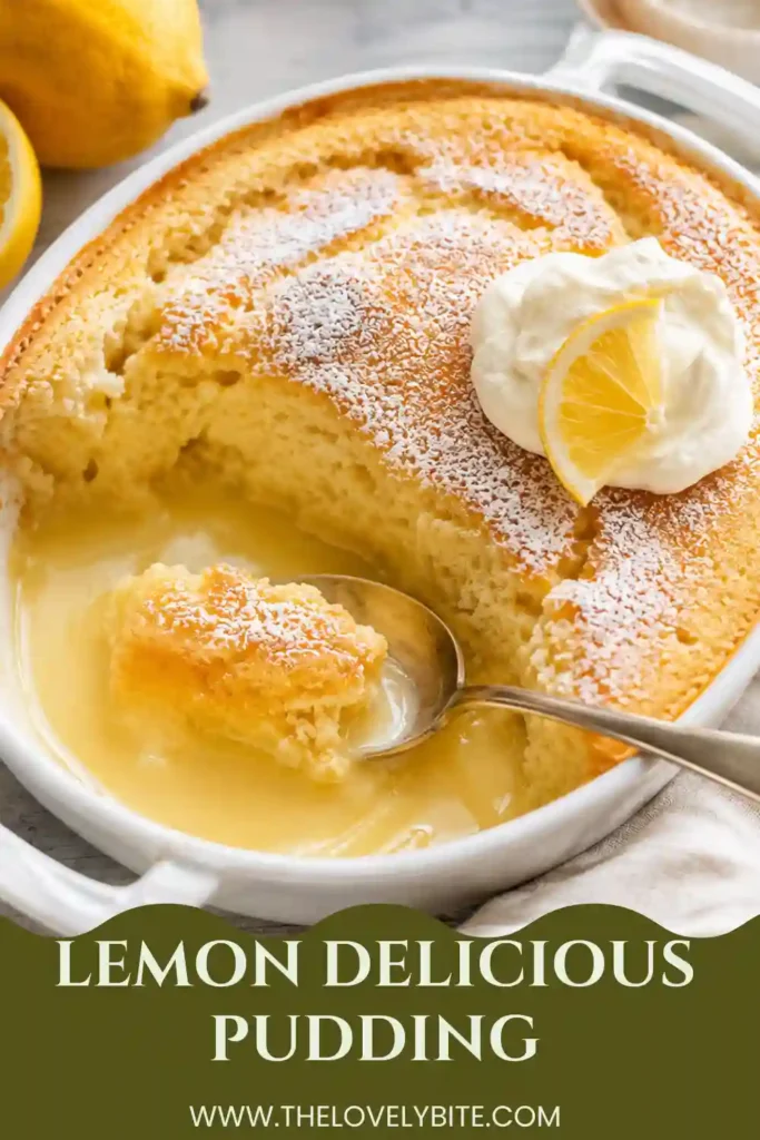 Homemade easy lemon pudding displayed in a ceramic dish with a fluffy golden sponge and visible lemon sauce. The pudding is decorated with raspberries, mint and a dusting of icing sugar.
