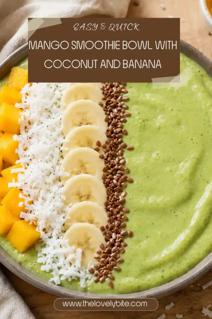 Mango Smoothie Bowl topped with fresh mango cubes, shredded coconut, chia seeds, and sliced almonds. The thick tropical smoothie base is made with frozen mango, banana, and coconut milk.