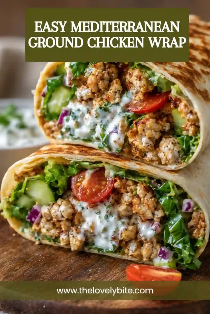 Mediterranean chicken wrap with savory ground chicken, crisp vegetables, feta, and fresh greens folded inside a soft tortilla. Creamy hot honey sauce adds a sweet and spicy finish.