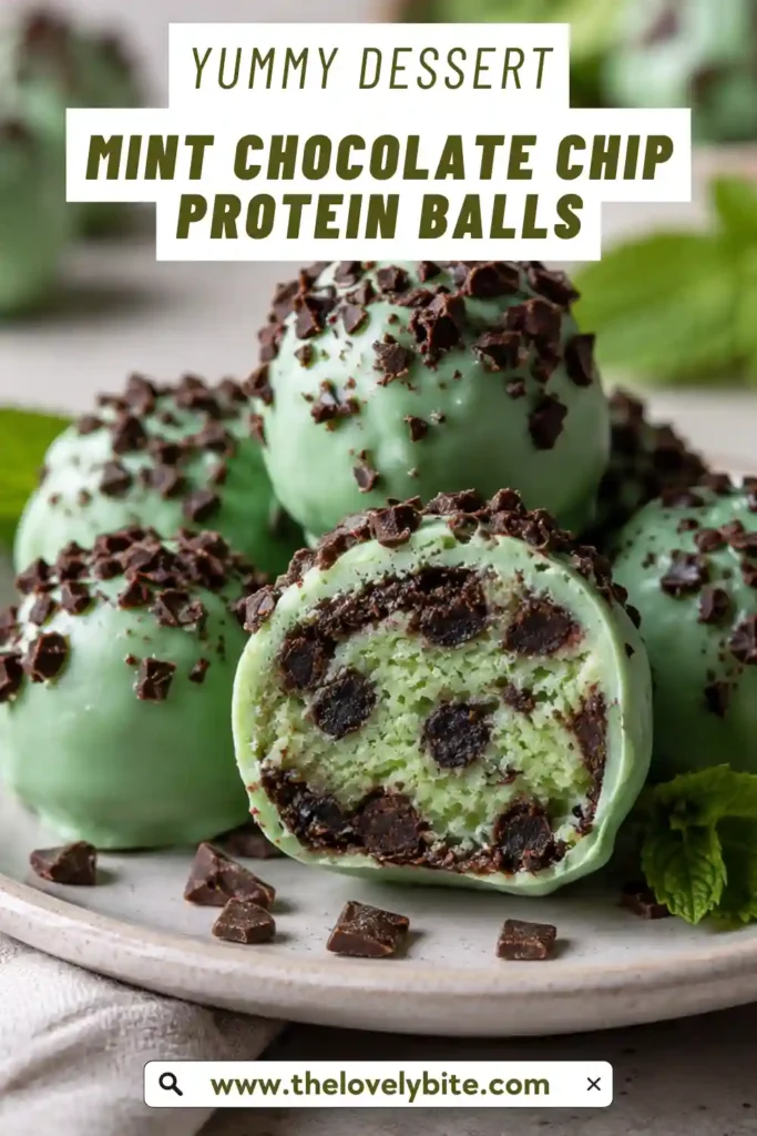 Mint Chocolate Chip Protein Balls arranged on parchment with glossy chocolate coating and dark chocolate chips. A sliced protein bite reveals the soft mint cashew filling.