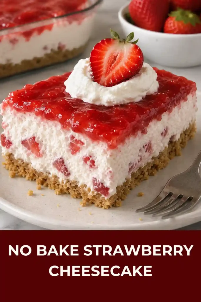 Close-up view of no bake strawberry cheesecake showing the Golden Oreo crust, creamy cheesecake layer, whipped topping, strawberry glaze, and fresh berries. The layered dessert has a rich, creamy texture and bright strawberry topping.